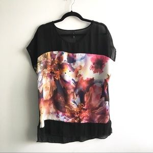 Semi-sheer top with floral watercolor graphic.